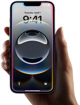 Ruka držící iPhone 16e, slabá barevná záře kolem okrajů displeje přes celou plochu